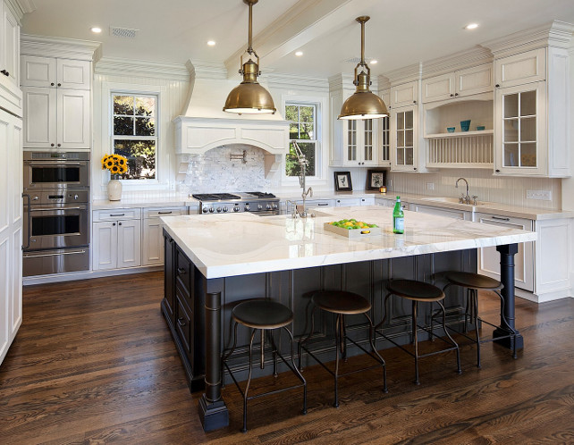 Linen White Benjamin Moore Kitchen. Kitchen. Off-white kitchen. Creamy white kitchen. Ivory kitchen cabinet with black island, marble countertop and oak wood flooring. Kitchen Pendants are the LARGE COUNTRY INDUSTRIAL PENDANT WITH METAL SHADE.