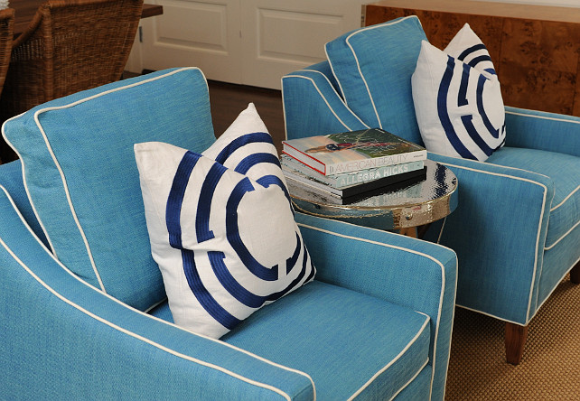 Living Room Chair and Pillow Ideas. Coastal Living room chair and pillow ideas. This coastal living room also features blue armchairs with white piping and decorative pillows and a accordion side table. #LivingRoom #Coastal #Chair #Pillows