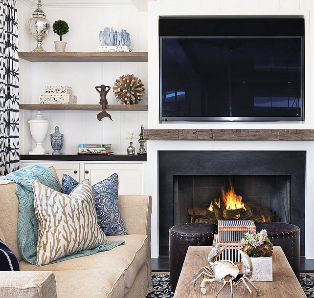 Living Room. Living Room Bookcase on both sides of fireplace. The bookshelves are made or reclaimed wood with backdrop made of shiplap. #livingroom #Bookcase #Bookshelves Blackband Design.