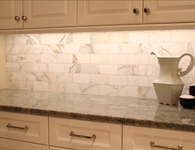 Marble Kitchen Backsplash. The backplash on the side walls of the kitchen are calcutta gold marble 3x6 in a running bond pattern. #Marble #Kitchen #Backsplash