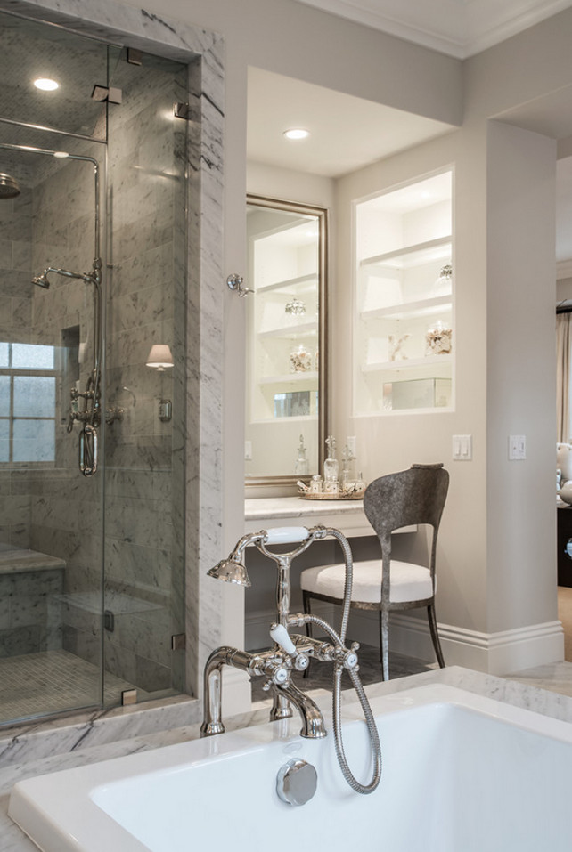 Master Bath Ideas. This master bathroom features a built-in vanity under silver leaf mirror, next to built-in niche filled with shelves beside a large glass shower. Legacy Custom Homes, Inc.
