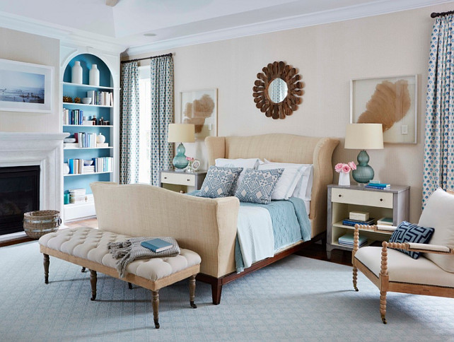 Master Bedroom. Coastal Inspired Bedroom with fireplace and neutral color scheme. The master bedroom is wallpapered in grass cloth by Phillip Jeffries. #Bedroom #MasterBedroom