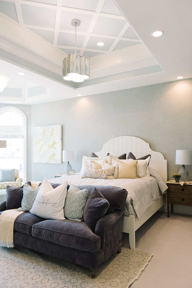 Master Bedroom. The master bedroom features white bed, tray ceiling and pillows with fabrics by Sarah Richardson. #MasterBedroom #SarahRichardson #Fabric Four Chairs Furniture.