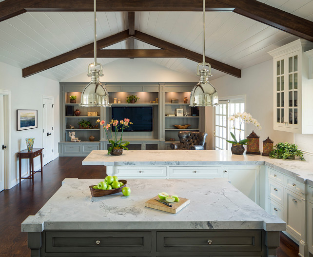 Media center and cabinets are a Benjamin Moore Coventry Gray. The perimeter cabinets are Swiss Coffee Benjamin Moore. The Island cabinets are Chelsea Gray Benjamin Moore. Wall Paint Color is Balboa Mist Benjamin Moore 1549. 