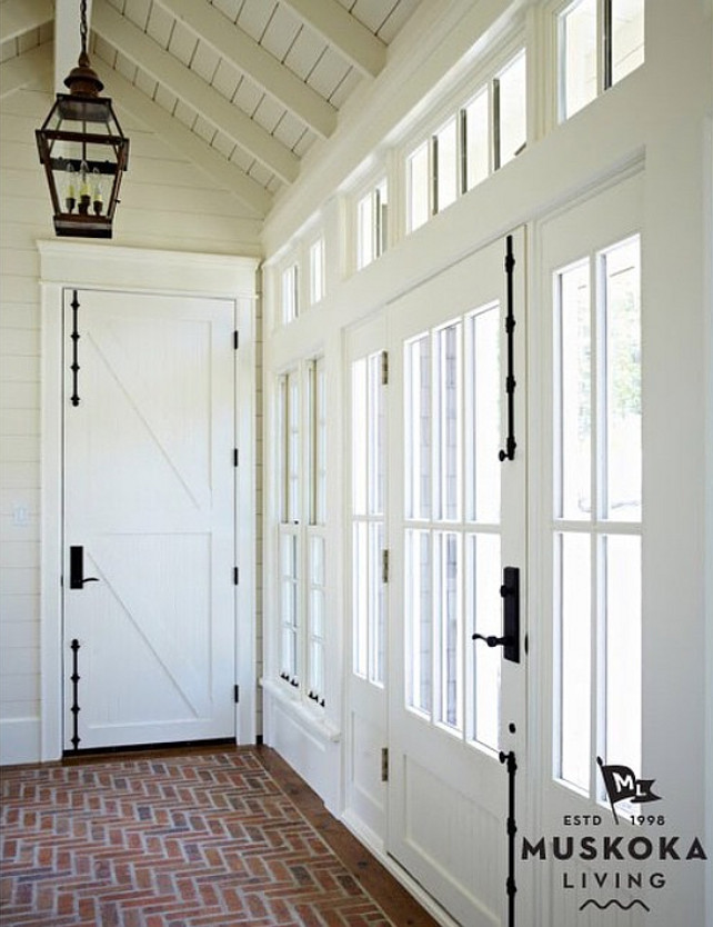 Mud room. Mud room with brick flooring. Coastal Mud room. Door and Window Hardware. #Mudroom #CoastalMudroom #Brick #Floor #Door #Window #Hardware Interiors by Muskoka Living Interiors.