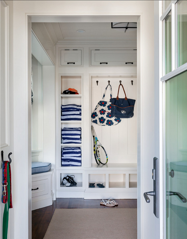 Mudroom Design. Great storage ideas are found in this mudroom. Paint Color is 50% China White, 50% Linen White by Benjamin Moore. #Mudroom #MudroomIdeas