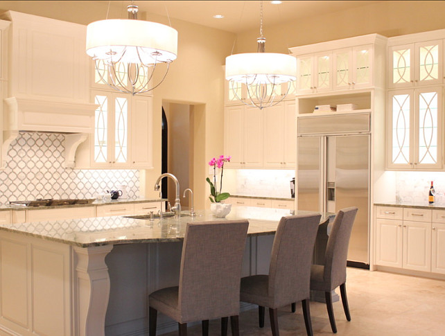 NR Interiors. Kitchen Lighting Ideas. These two chandeliers above the island are by ELK Lighting, model #101216 in polished nickel finish and are available with or without the drum shade. #KitchenLighting #KitchenIdeas