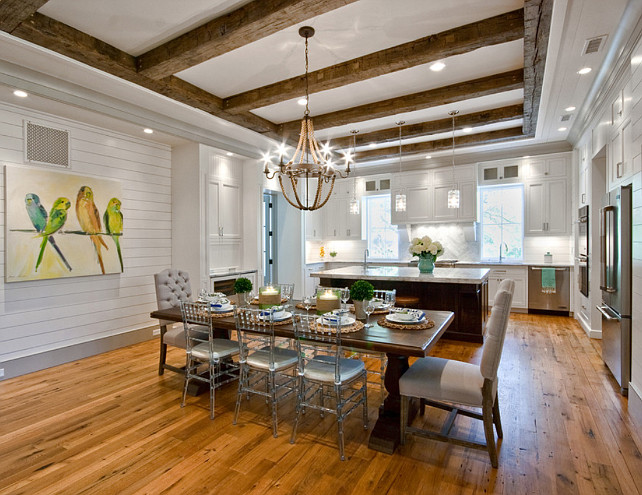 Open Floor Plan. Kitchen Open Floor Plan. Open Concept. Open Layout Kitchen. Clear chairs, Darker Trim, glass pendants, kitchen open plan, reclaimed beams, reclaimed oak, rope light, shiplap, tufted chairs, white cabinets, wood floors. Ink Architecture.