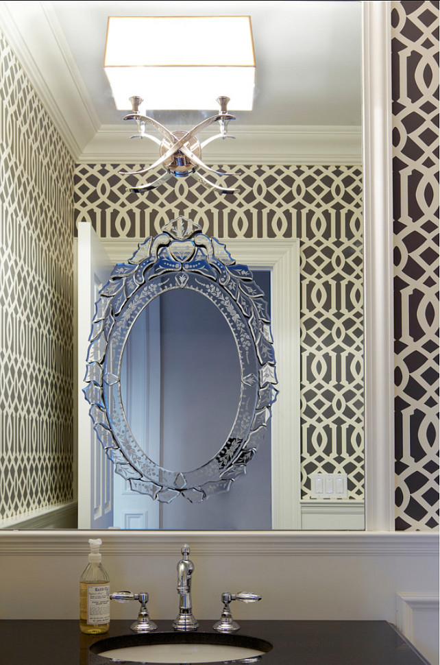 Powder Room Design Ideas. Bold pattern charcoal and cream wallpaper was used to brighten up the walls above the paneling. Imperial Trellis in Parchment Midnight