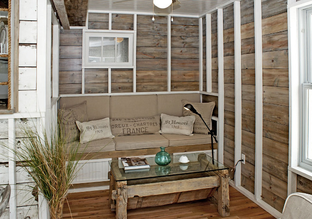 Reclaimed Wood Wall. Reclaimed Wood Wall Ideas. Coastal Reclaimed Wood Wall. Rough-hewn beams, 100-year old barn floors and reclaimed wood walls are features of this seating area as well as the dining and living areas that surround the kitchen that sits at the center of the ground floor. #ReclaimedWood #Wall