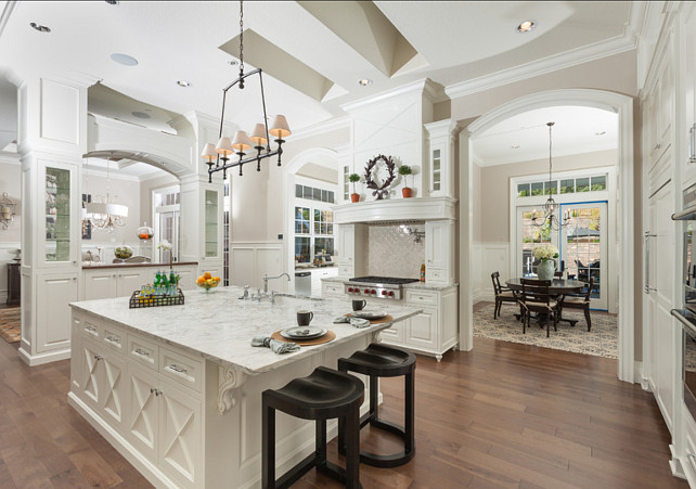 white kitchen shelves with black counter tops