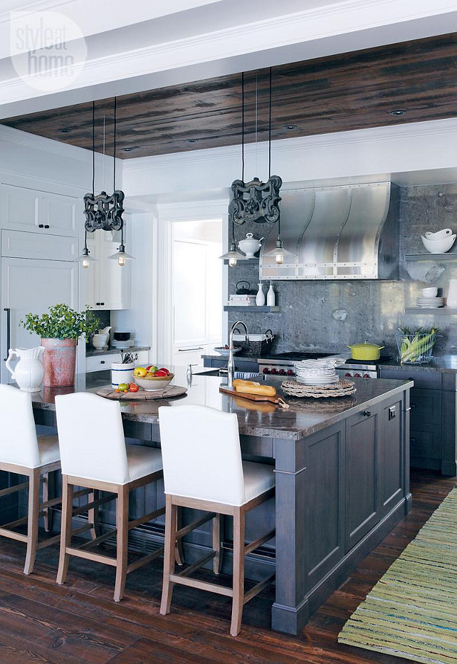 Rustic Cottage Kitchen. Kitchen The kitchen has an open-concept style with white dishware. #RuticKitchen #Kitchen #Coastal #Cottage #CoastalKitchen #CottageKitchen Via Style at Home.