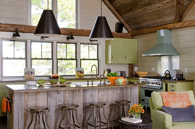 Rustic kitchen with a modern feel. Rustic kitchen with a modern feel. Rustic kitchen with rustic wood ceiling and plank island with modern elements. #Kitchen #RusticInteriors #ModernKitchen #RusticKitchen OLSON LEWIS + Architects. This rustic kitchen features reclaimed barn board planked cathedral ceiling over a barn board kitchen island with farm sink and gooseneck faucet. The island features industrial backless counter stools illuminated by a pair of Goodman Hanging Lamps in Antique Nickel. The green cabinets are painted in Valspar La Fonda Olive and are accented with oil-rubbed bronze cup pull hardware. Rustic kitchen with rustic wood ceiling and plank island with modern elements. #Kitchen #RusticInteriors #ModernKitchen #RusticKitchen OLSON LEWIS + Architects.