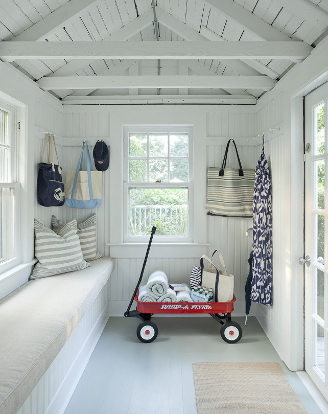Shed Interior Ideas. This backyard shed is used as a playroom - play area for the kids. The playroom features painted wooden floors and a window seat. #Playroom #Playarea #shed Emily Gilbert Photography.