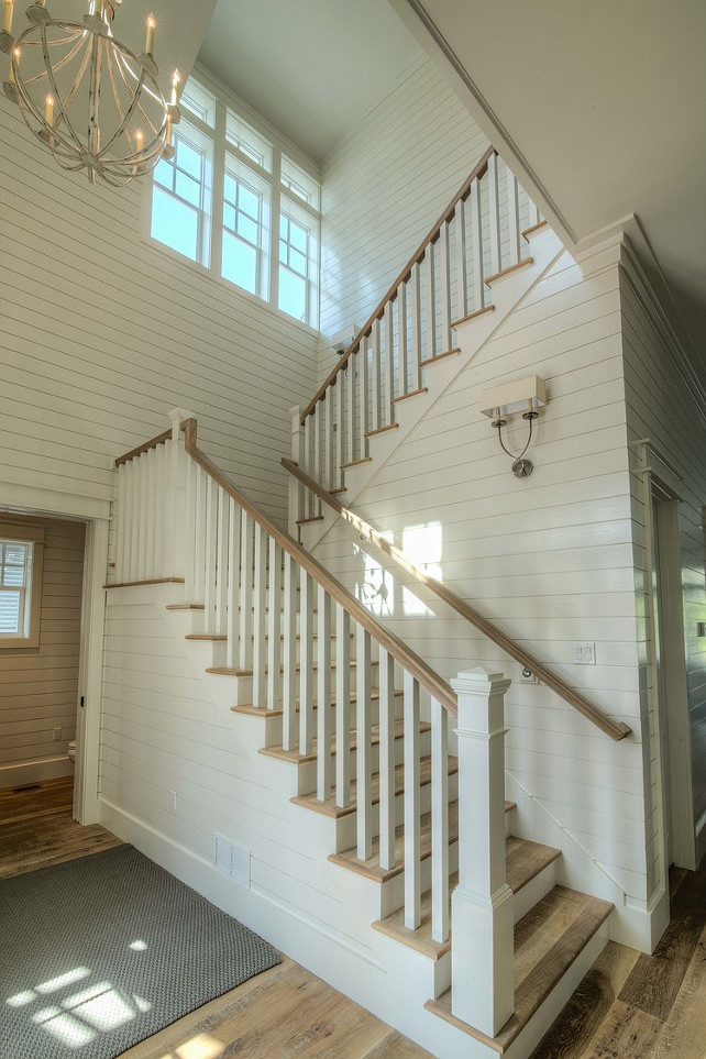 Shiplap Foyer. Shiplap foyer staircase. Shiplap foyer ideas. Beach house with shiplap foyer and wrapround staircase. #Foyer #Shiplap Christ & Associates.
