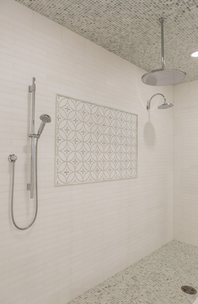 Shower Tiling. Shower Tiling and Flooring. Shower Tiling and Flooring Combination. The shower features white linear tile surround accented with decorative inset tiles and mosaic marble tile on ceiling and floor. #ShowerTiling #ShowerFlooring #Tiling #Flooring Brookes and Hill Custom Builders.