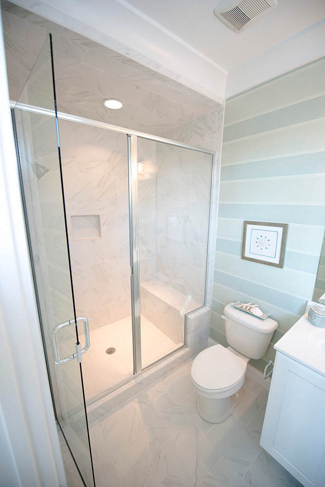 Small Bathroom Layout. How to design a small bathroom layout without making it appear claustrophobic. This is a good example of small bathroom layout. Notice that the shower even features a seating area. #SamllBathroom #SmallSpaces #SmallInteriors