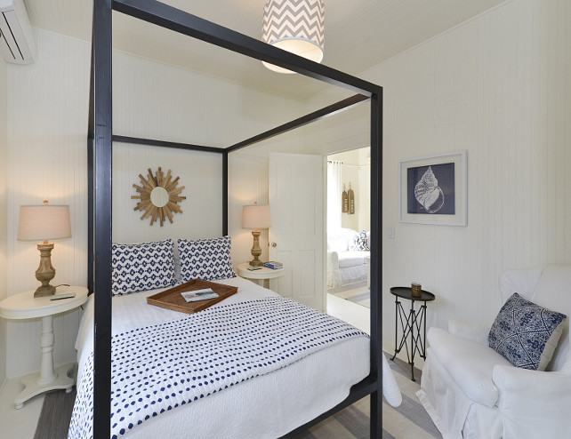 Small Coastal Bedroom. Small Coastal Bedroom with Canopy Bed. Small Coastal Bedroom with white walls and coastal art. #SmallCoastalBedroom