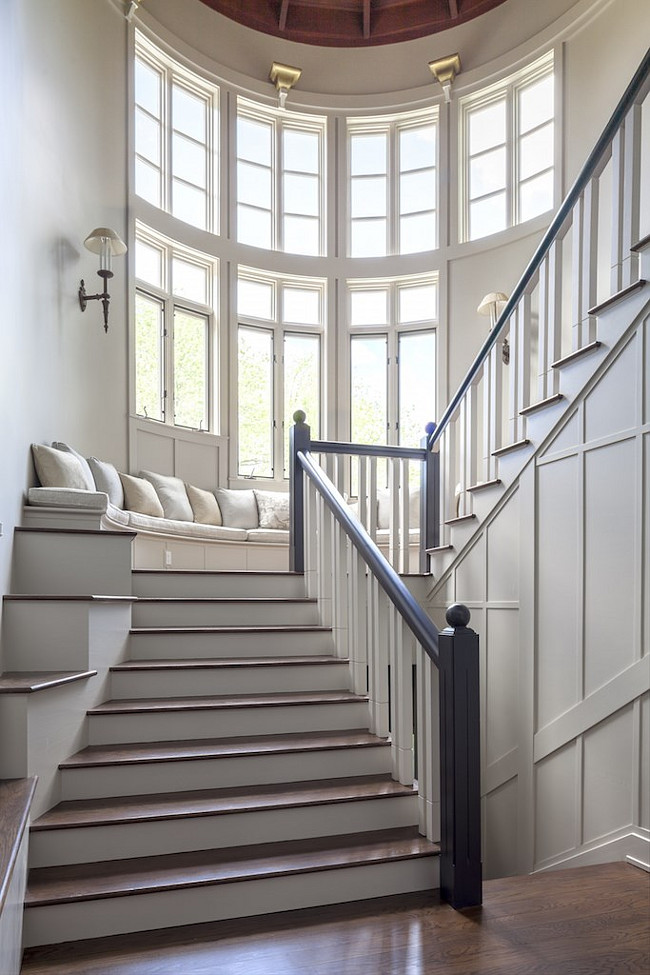 Stairway Bench. Stairway Window Bench. Stairway window seat Bench. Grand stairway with bench under wall of windows. #Stairway #Bench #Windowseat Via Christies Real Estate