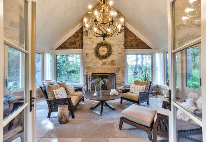 Sunroom. Cathedral Ceiling Sunroom. This sunroom features cathedral ceiling and a stone fireplace. #Sunroom #CathedralCeiling #Stone #Fireplace Sotheby's Homes Canada.