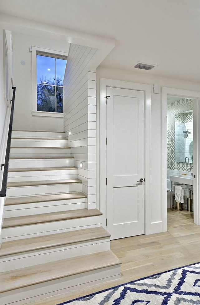 Under stairs Room Ideas. A closet and Powder room is located under the stairs. Redbud Custom Homes.