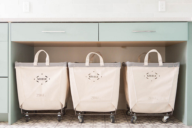 Vintage Rolling Laundry room Carts. Steele Canvas laundry carts. Laundry room with three Steele Canvas laundry carts tucked below a countertop. #LaundryRoom #SteeleCanvaslaundrycart Ashley Winn Design.