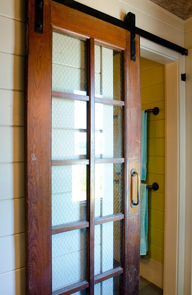 Vintage Sliding Barn Door with vintage door hardware. The sliding door is vintage and chicken wire was added to deliver some character. The designer got it at Old House Parts in Kennebunk Maine. #Vintage #Door #SlidingDoor Kristina Crestin Design.