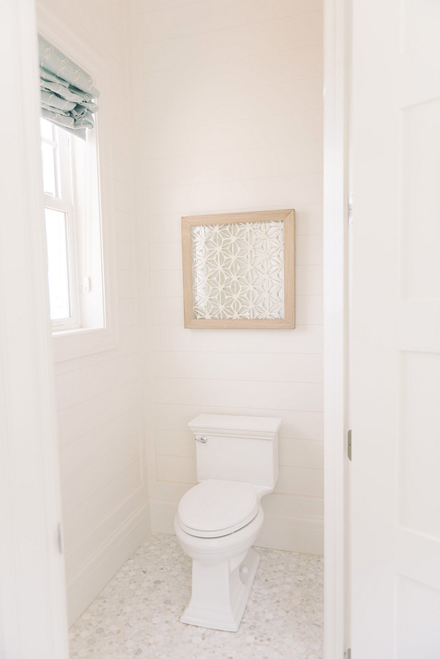 Water Closet with shiplap walls. Four Chairs Furniture.