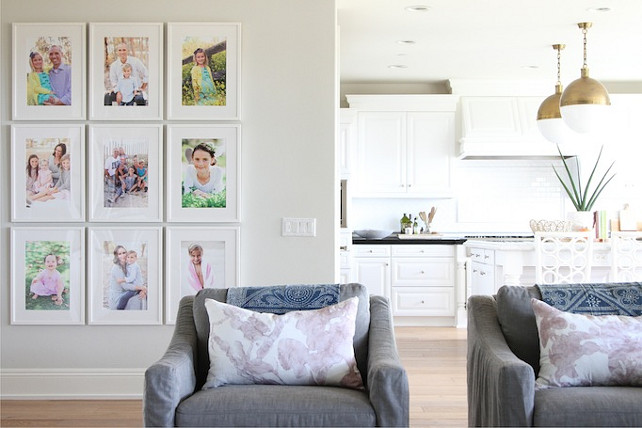 White Gallery Picture Wall. Home project featuring a white gallery wall filled with family photos. Becki Owens.
