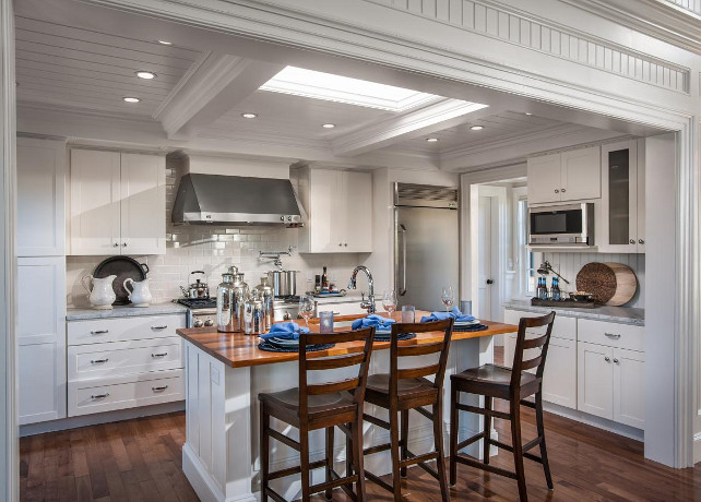 White Kitchen. Classic white kitchen with beamed ceiling, skylight, crisp white cabinets, wood floors and custom kitchen island. #Kitchen #WhiteKitchen #HGTV2015DreamHouse