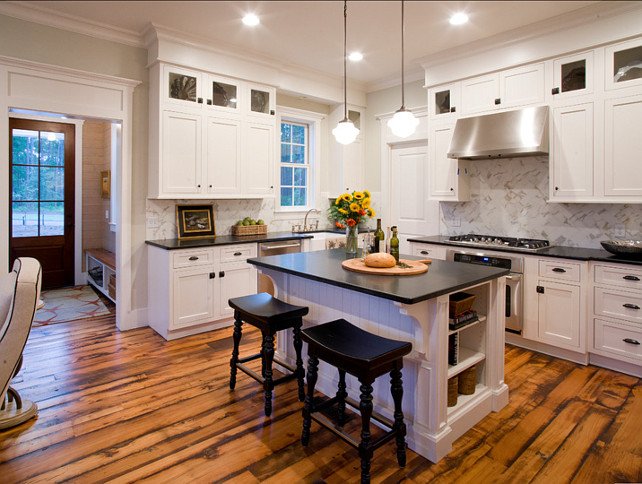 White Kitchen. Inspiring white kitchen with classic cabinets. Pendant Lighting are Hudson Valley Pendants 9413 from Hagemeyer.#WhiteKitchen #Kitchen