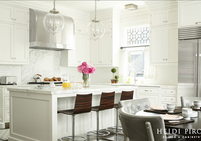 White Kitchen. White Kitchen. Transitional White Kitchen. Kitchen Crown Molding Ideas. To balance the kitchen's existing 10-foot ceiling, three-piece crown molding was selected, instead of the more common two-piece crown, so that the wall cabinets would not appear so tall and towering. #WhiteKitchen #TramsitionalWhiteKitchen