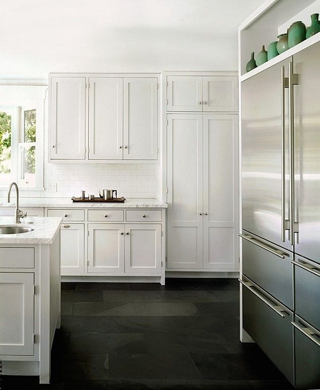White kitchen Flooring Ideas. White kitchen cabinet with bluestone tile flooring. #Bluestone #KitchenFlooring #TileFlooring #WhiteKitchenFlooring Via Remodelista.