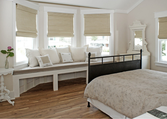 Window seat. Bedroom with window seat. Bedroom window seat fabric. A guest room with a romantic mix of late 19th century Americana and Provencial detailing has a large window seat in the turret that affords expansive views of Beach Haven's most beautiful Victorians down the street. #Bedroom #WindowSeat 