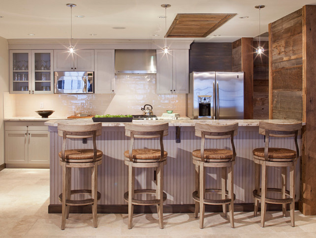 Rustic Kitchen. Rustic kitchen with gray cabinets. Kitchen backsplash is Harvest Collection / Cream available through Materials Marketing Denver. The barstools are by Lexington. Pendant lighting is the Stone Lightings Gracie Pendants. The countertop is granite. #Rustic #Kitchen Kristine Pivarnik Design, LLC.