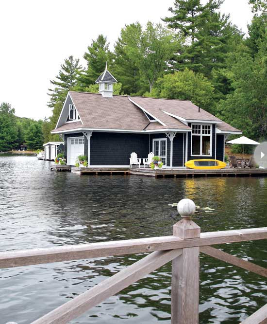 Boathouse. Boathouse Ideas. The large dock alongside the boathouse boasts a sitting area for two and a rustic dining spot. Colourful containers mark the corners of the dock for a pleasing look. Via Style at Home.