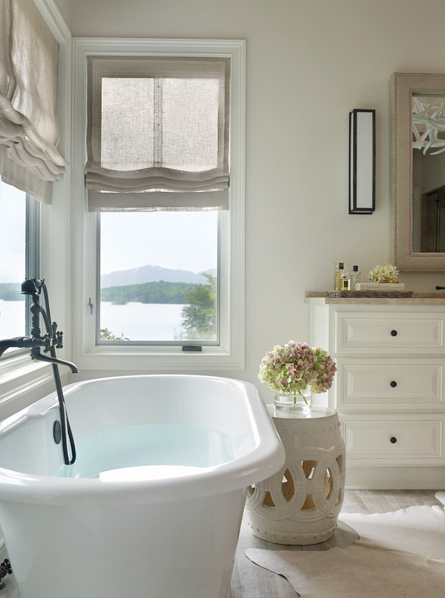 Bathroom Ideas. Bathroom elements. The Paint Color in this bathroom is China White by Benjamin Moore, countertop stone is Jerusalem Grey Limestone and hardwood floors were limewashed using ROMA Products. Beth Webb Interiors. 