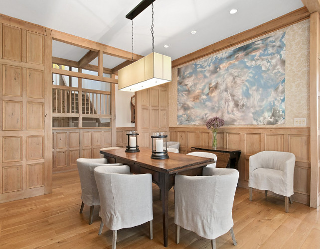 Dining Room. Ecletic Dining Room Design. Gorgeous eclectic dining room with rich oak paneled walls, linen slipcovered dining chairs, vintage farmhouse table and linen shade rectangular chandelier. #diningroom