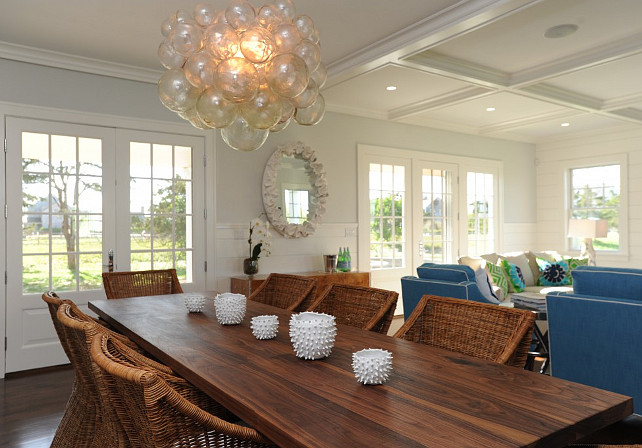 Dining Room. Cottage Dining room with glass bubble cluster chandelier. Cottage Dining Room. Stunning open concept dining living room with a walnut dining table lined with William Sonoma Farallon Armchairs below a glass bubble cluster chandelier. #DiningRoom #Cottage #CottageDiningRoom #GlassBubbleClusterChandelier