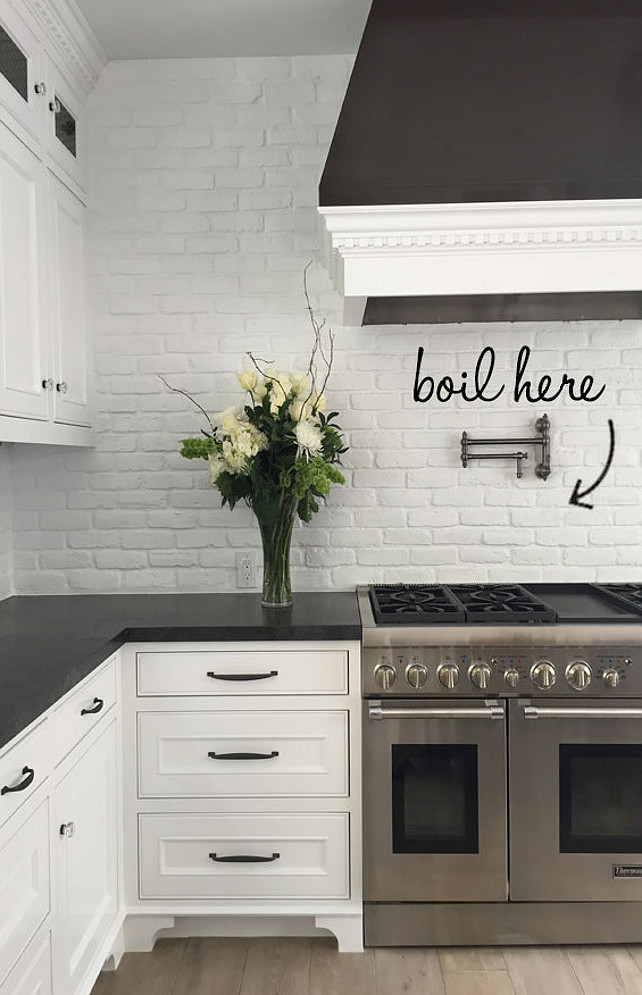 Brick Backsplash. Kitchen Brick Backsplash Painted in White. Transitional kitchen with white painted brick backsplash and honed black granite countertop. #Brick #Backsplash #Kitchen #WhiteBrick #paintedBrick Blackband Design.