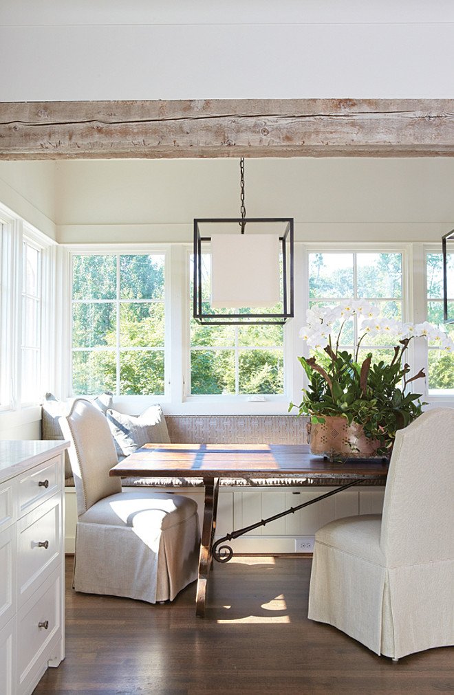 Banquette. A favorite gathering spot in this house is a built-in banquette in the kitchen. “The table really set the stage for the entire house,” Jan says. “We built so much of the rest of the house around it.” Large enough to seat at least 10, the table is an antique French piece with iron strapping. To counterbalance the table’s size, Jan chose to include it in a breakfast nook and add upholstered banquette seating around it. DESIGNER: Jan Ware 