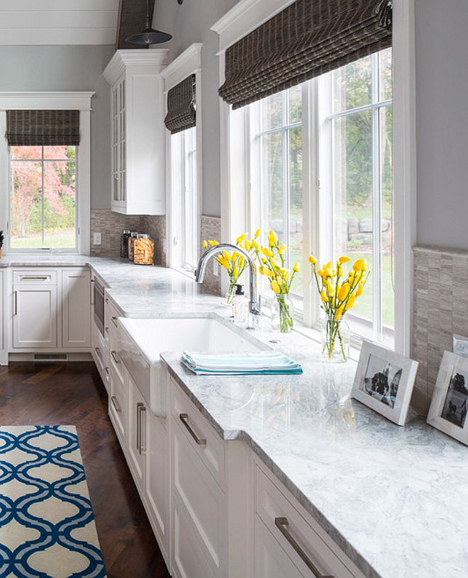 Kitchen Farmhouse Sink. Kitchen farmhouse sink with gooseneck faucet. Countertop is Vanilla Ice Granite. Kitchen paint color is Sherwin Williams SW 0055 Light French Gray and Cabinet paint color is Sherwin Williams SW 7004 Snowbound. Martha O'Hara Interiors. 