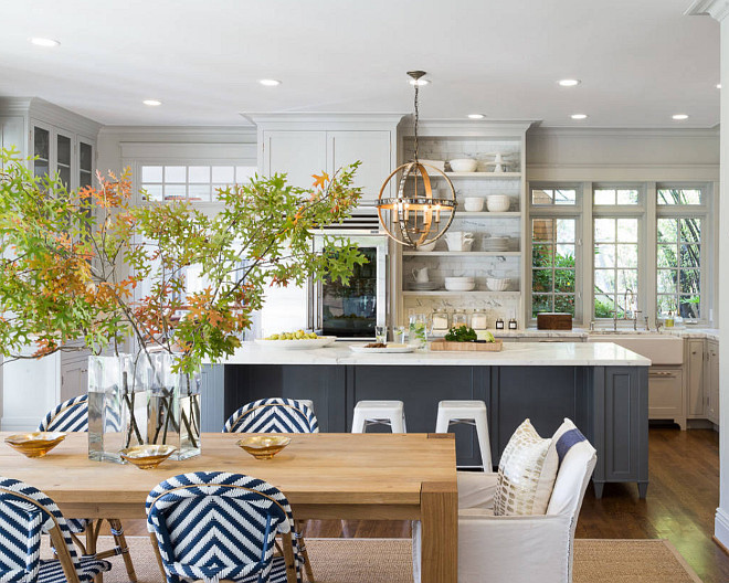 The Ultimate Gray Kitchen Design Ideas. Dining Room opens to kitchen. Dining room opens to kitchen area with charcoal gray island and pale gray cabinets. #diningroom #kitchen #interiros Heydt Designs. Benjamin Dhong Interiors.