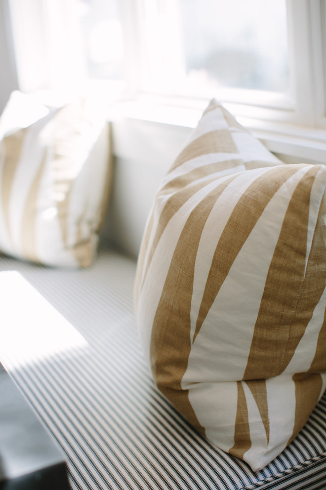 Breakfast nook bench fabric. Breakfast nook bench cushion fabric. The built-in bench fabric is a ticking stripe by Robert Allen that the designer had laminated. This idea is great for people with kids at home. Rita Chan Interiors.