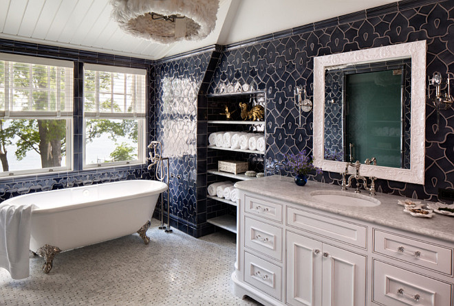Blue and white bathroom. White bathroom with blue wall tiles. Navy blue and white bathroom. Light fixture is White Feather Pendant from Clayton Gray Home. #Blueandwhite #Bathroom #navytiles #bluenavy #WhiteFeatherPendant Wade Weissmann Architecture. 