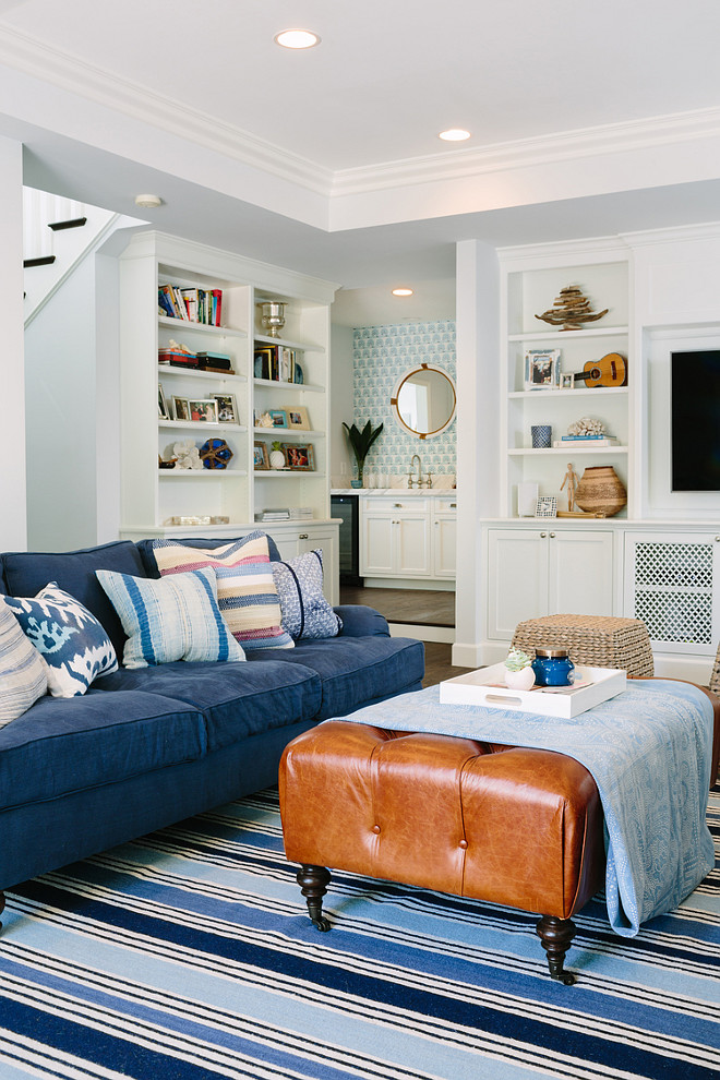 Blue striped rug with indigo sofa. Living room with Blue striped rug with indigo sofa. #Bluestripedrug #indigo #sofa #livingroom Rita Chan Interiors.