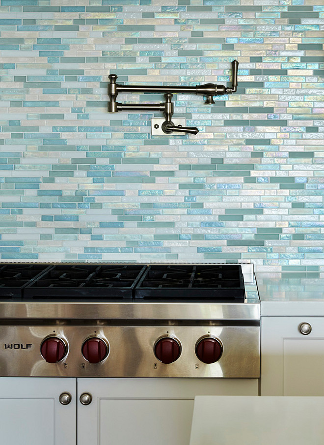 Sea Glass Tile Backsplash. Beach house Sea Glass Tile Backsplash. Blue Sea Glass Tile Backsplash. Blue Shimmer Backsplash. The big star of this kitchen is the turquoise 1" x 4" shimmery backsplash tile. #SeaGlassTile #Backsplash #kitchen #beachhouse JMA Interior Design.