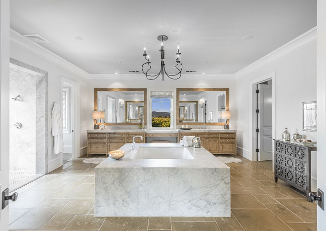 Bath in the middle of bathroom. Bathtub is placed in the middle of bathroom. Bathroom cabinetry is made of cypress. #Bathroom