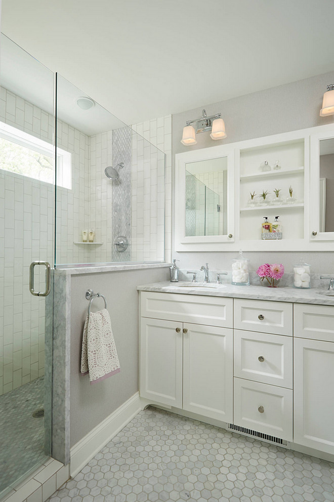 Bathroom Flooring. Grya bathroom flooring. Light gray bathroom flooring. The floor tile is the Hampton Carrara Polished Hex 2” from The Tile Shop. Anchor Builders. 