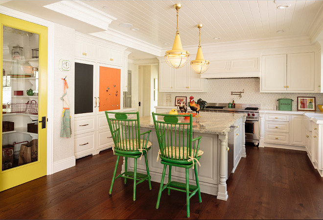 Farmhouse Kitchen. Kitchen with built in banquette, walk in pantry, side by side hidden refrigerators, 48" Wolf range, hardwood flooring, unusual lighting. 